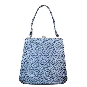 Jackie O feel handbag with a top metal clasp in black and grey/silver